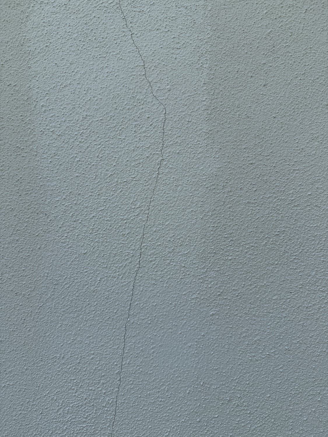 Crack in textured stucco before patching
